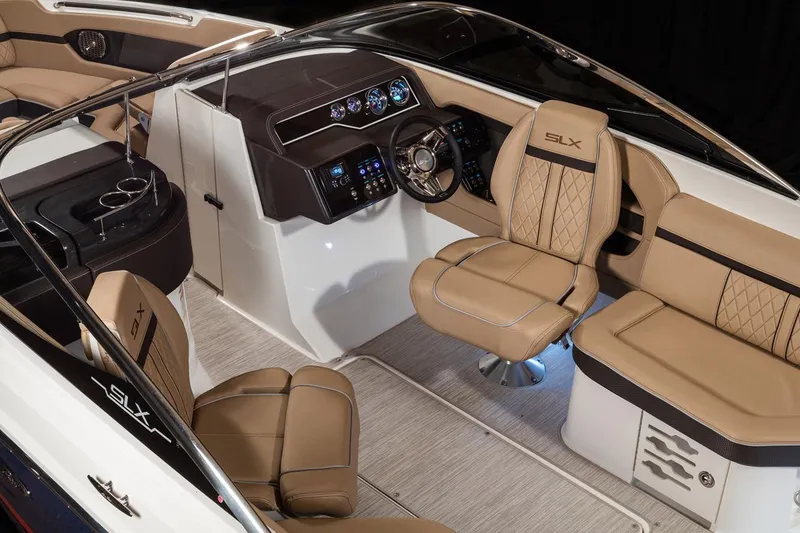 Slide: The Image of Manufacturer Provided Image: 2018 Sea Ray SLX 250 boat interior with tan leather seats and modern dashboard. - 6