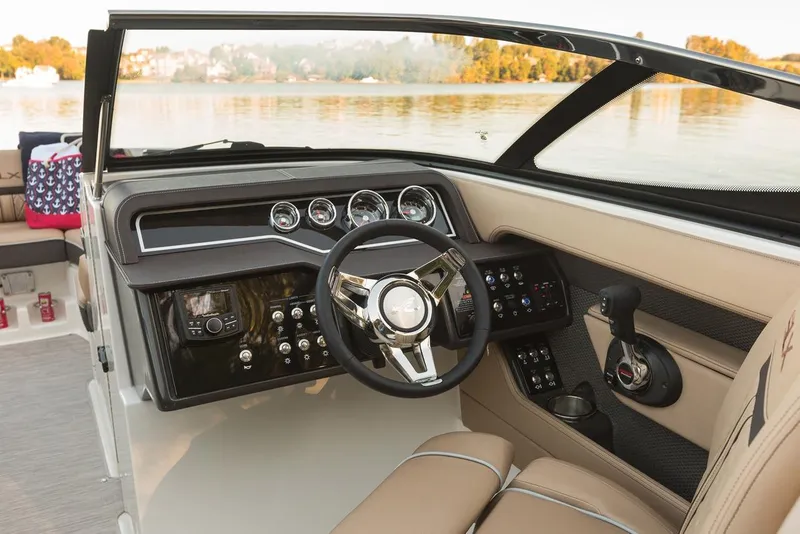 Slide: The Image of Manufacturer Provided Image: 2018 Sea Ray SLX 250 boat dashboard with steering wheel and control panel. - 7
