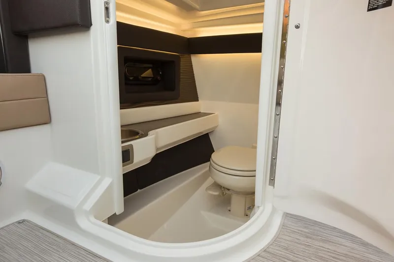 Slide: The Image of Manufacturer Provided Image: 2018 Sea Ray SLX 250 boat interior bathroom with modern amenities. - 8