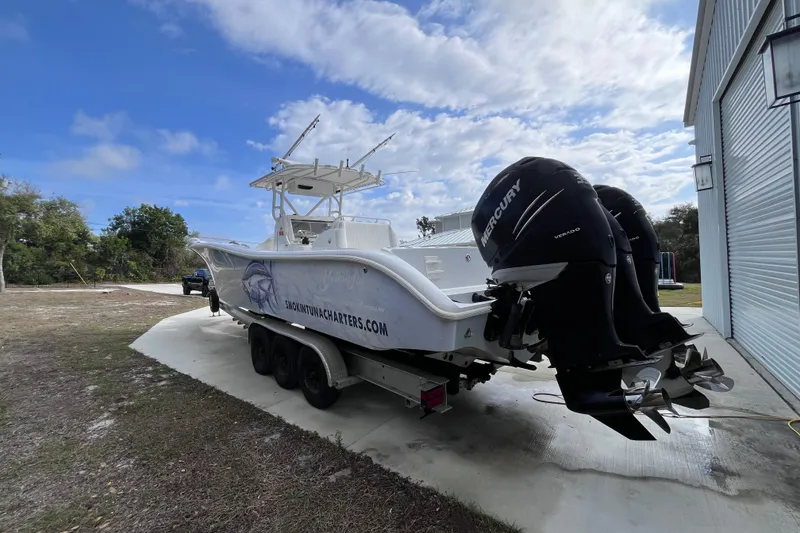 Slide: The Image of 2004 Yellowfin 36 Offshore boat with dual Mercury engines on a trailer. - 4