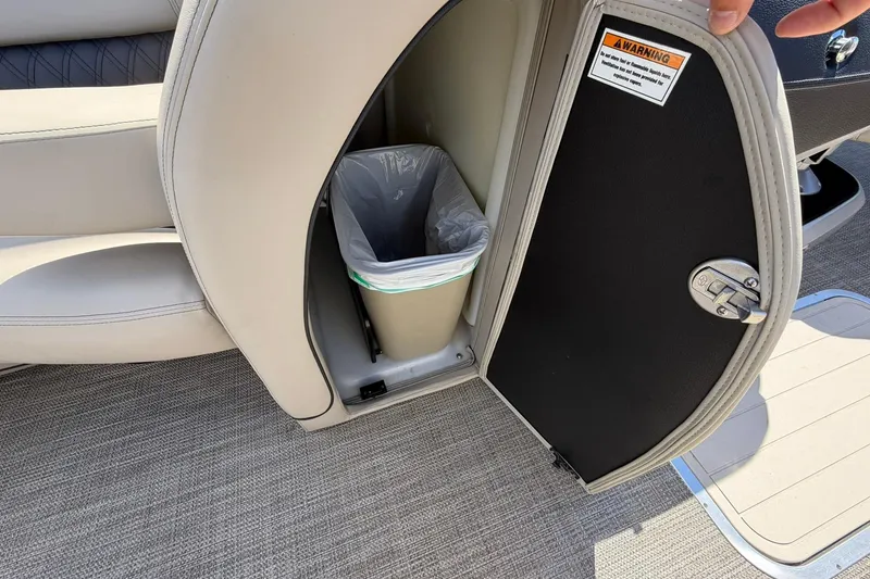 Slide: The Image of 2020 Barletta L25U boat interior with built-in trash compartment. - 12