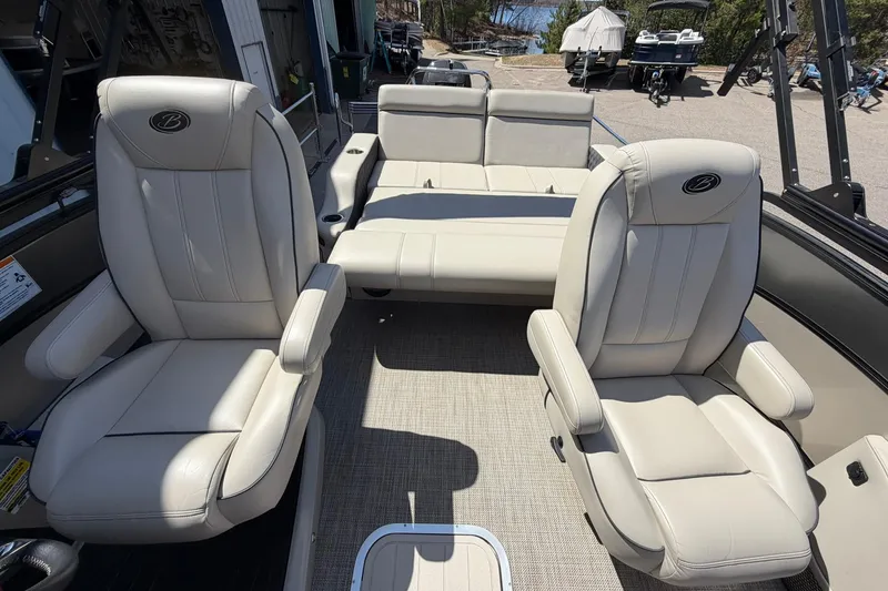 Slide: The Image of 2020 Barletta L25U boat interior with beige seating and armrests. - 14