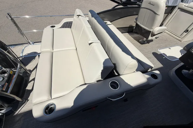 Slide: The Image of 2020 Barletta L25U boat interior with beige seating and cup holders. - 20
