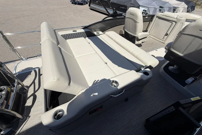 Slide: The Image of 2020 Barletta L25U pontoon boat interior with luxurious seating and cup holders. - 21
