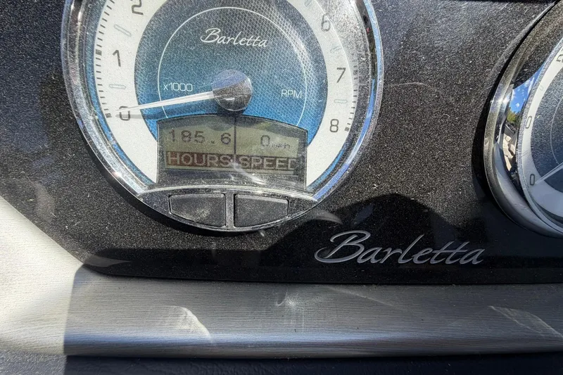 Slide: The Image of Close-up of Barletta L25U 2020 dashboard showing RPM and hour meter. - 27