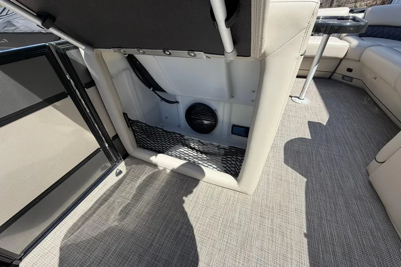 Slide: The Image of 2020 Barletta L25U boat interior with storage compartment and seating area. - 28