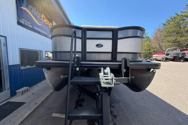 Slide: The Image of 2020 Barletta L25U pontoon boat on trailer outside dealership. - 6