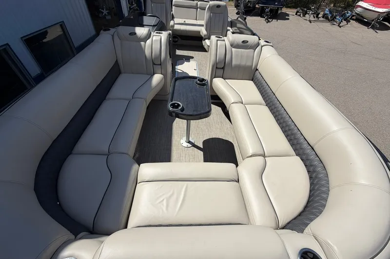 Slide: The Image of Luxurious seating on a 2020 Barletta L25U pontoon boat with beige upholstery. - 8