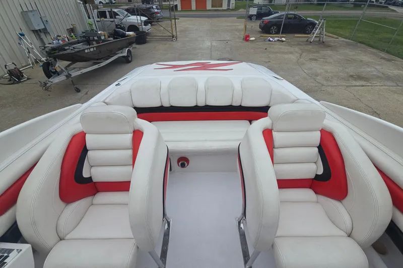 Slide: The Image of 1999 Donzi 28 ZX boat interior with white and red seating. - 10