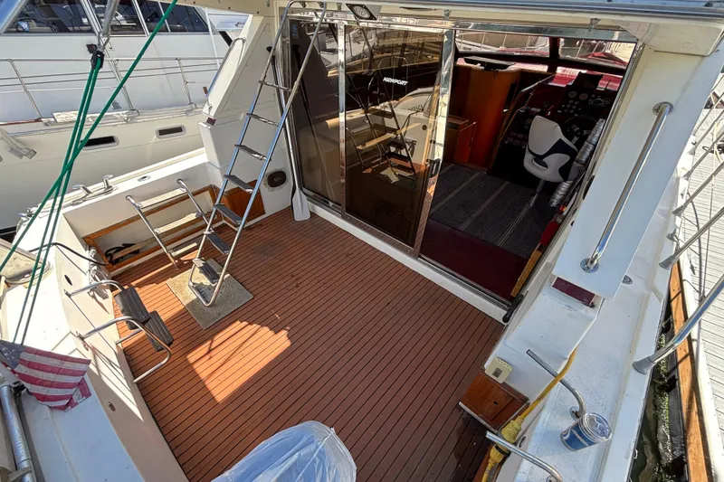 Slide: The Image of 1984 Posillipo Technema yacht deck with ladder and cockpit view. - 13