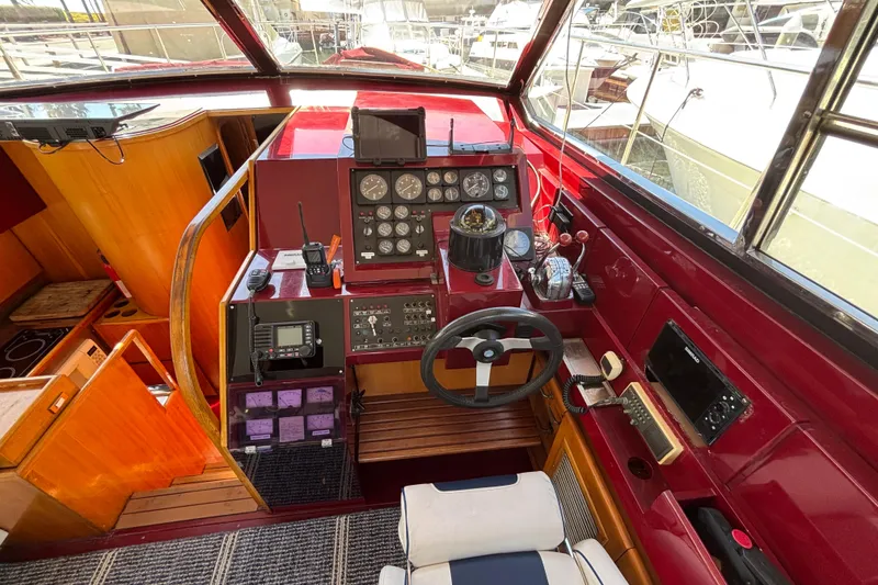 Slide: The Image of Cockpit of a 1984 Posillipo Technema yacht with navigation instruments and steering wheel. - 4