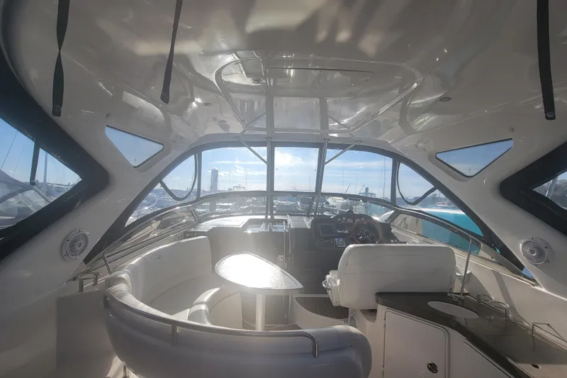 Slide: The Image of Interior view of 2007 Regal Commodore 3760 IB yacht, featuring helm and seating area. - 11