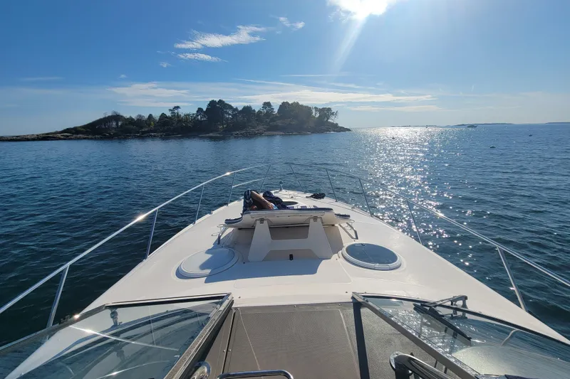 Slide: The Image of 2007 Regal Commodore 3760 IB cruising on a sunny day near a scenic island. - 13