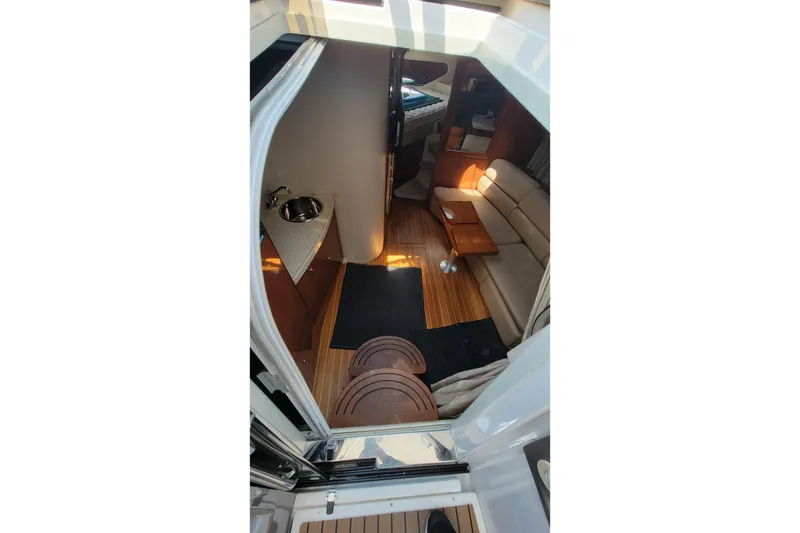 Slide: The Image of Interior view of 2007 Regal Commodore 3760 IB yacht, featuring seating and kitchenette. - 15