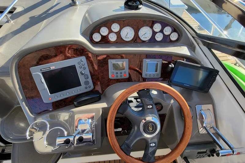 Slide: The Image of Control panel of a 2007 Regal Commodore 3760 IB boat with navigation instruments. - 18
