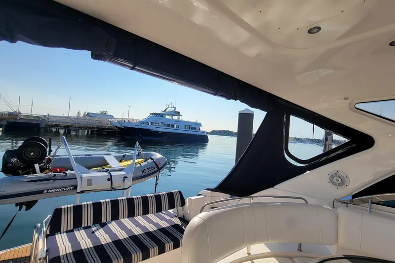Slide: The Image of 2007 Regal Commodore 3760 IB interior view with docked boats in the background. - 23