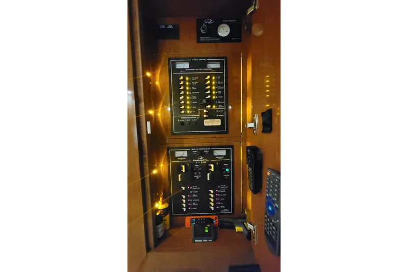 Slide: The Image of Control panel of 2007 Regal Commodore 3760 IB boat with illuminated switches and gauges. - 33