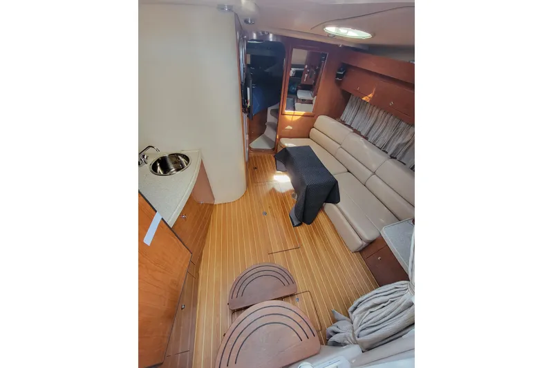 Slide: The Image of Interior of 2007 Regal Commodore 3760 IB yacht with wood flooring and beige seating. - 39