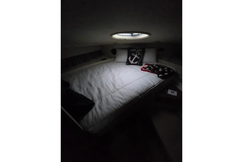 Slide: The Image of Cozy cabin interior of 2007 Regal Commodore 3760 IB with nautical-themed decor. - 42