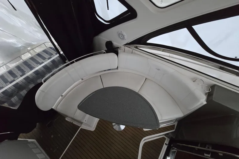 Slide: The Image of 2007 Regal Commodore 3760 IB interior with curved seating and table. - 43