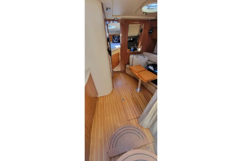 Slide: The Image of Interior of 2007 Regal Commodore 3760 IB yacht with wooden flooring and seating area. - 9