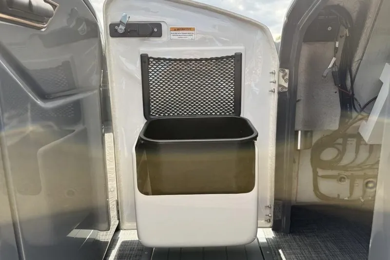 Slide: The Image of Interior view of 2026 Godfrey Sanpan 2700 ULW Twin boat with storage compartment. - 17
