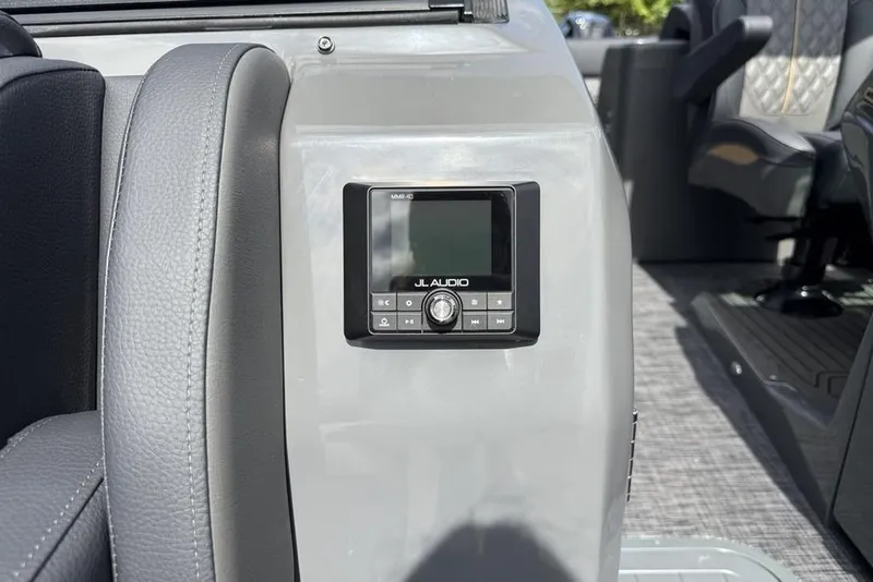 Slide: The Image of JL Audio system on 2026 Godfrey Sanpan 2700 ULW Twin boat interior. - 21