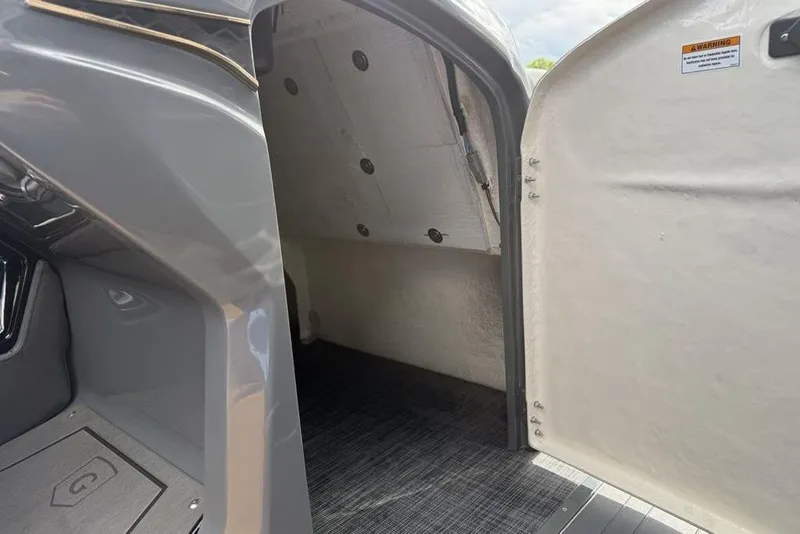 Slide: The Image of Interior view of 2026 Godfrey Sanpan 2700 ULW Twin boat cabin entrance. - 22