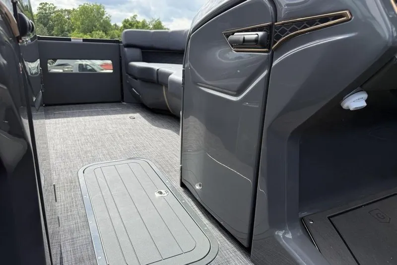 Slide: The Image of Interior of 2026 Godfrey Sanpan 2700 ULW Twin pontoon boat, featuring sleek seating and flooring. - 23