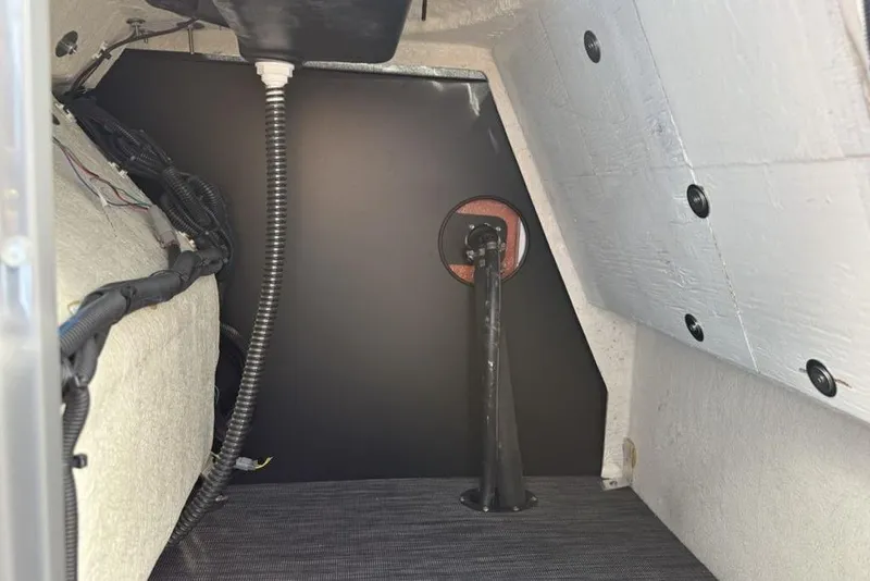Slide: The Image of Interior view of 2026 Godfrey Sanpan 2700 ULW Twin, showcasing wiring and structural components. - 26