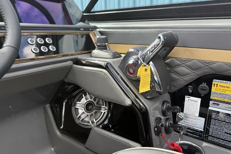 Slide: The Image of Interior of 2026 Godfrey Sanpan 2700 ULW Twin boat with control panel and speaker. - 31