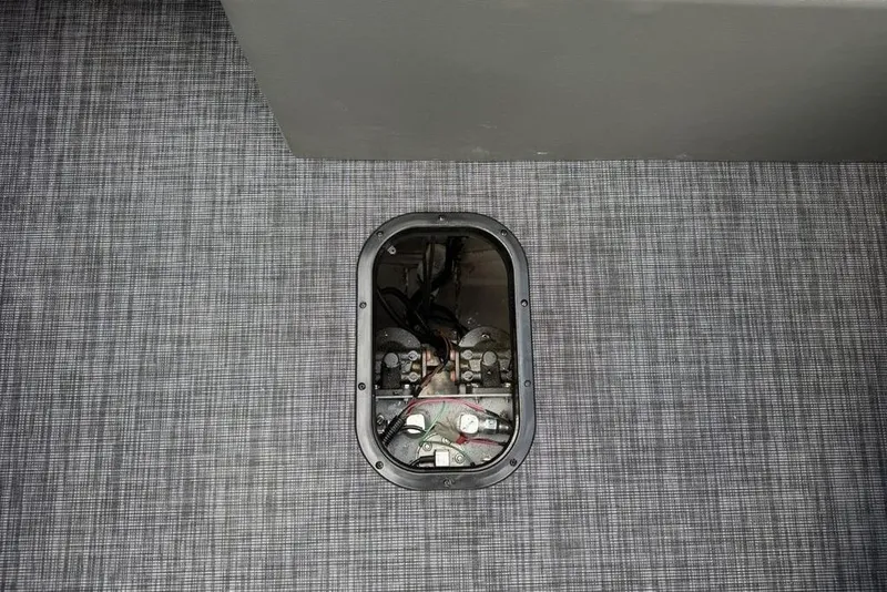 Slide: The Image of Battery compartment of 2026 Godfrey Sanpan 2700 ULW Twin on textured flooring. - 37