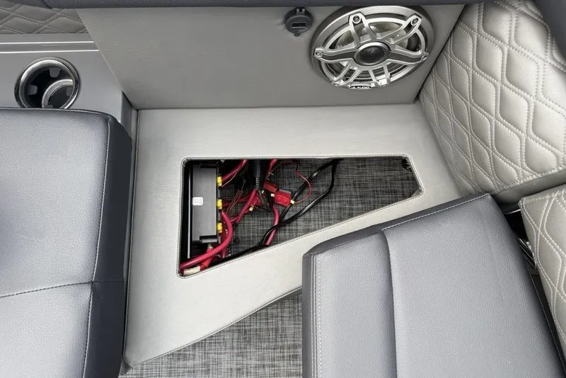 Slide: The Image of Interior of 2026 Godfrey Sanpan 2700 ULW Twin showing speaker and wiring compartment. - 39