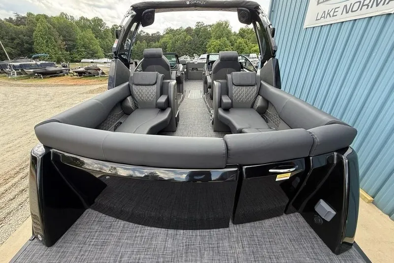Slide: The Image of Luxurious 2026 Godfrey Sanpan 2700 ULW Twin pontoon boat with plush seating and sleek design. - 48