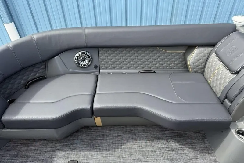 Slide: The Image of Luxurious seating on 2026 Godfrey Sanpan 2700 ULW Twin boat, featuring quilted upholstery and speaker. - 8