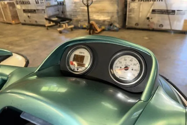 Slide: The Image of 2001 Sea-Doo GTX dashboard with speedometer and info gauge in a garage setting. - 10