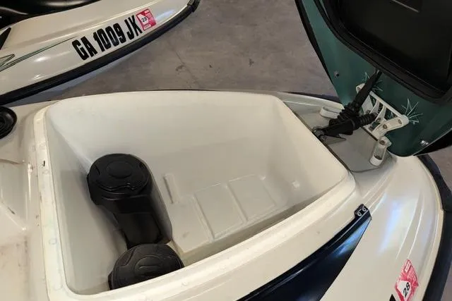 Slide: The Image of Open storage compartment of a 2001 Sea-Doo GTX watercraft with visible registration number. - 11