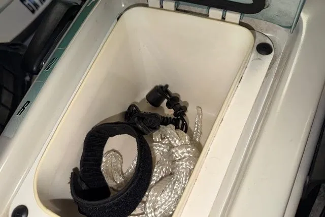 Slide: The Image of Storage compartment of a 2001 Sea-Doo GTX with rope and accessories. - 13