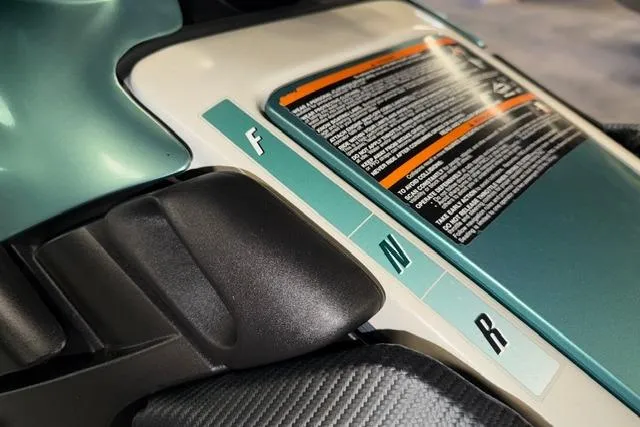 Slide: The Image of 2001 Sea-Doo GTX controls with forward, neutral, reverse indicators and safety instructions. - 14