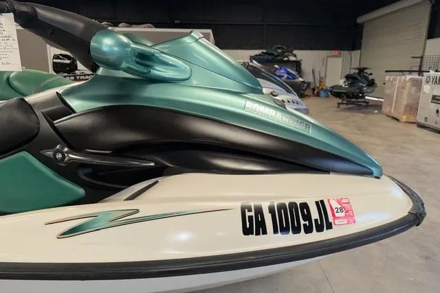 Slide: The Image of 2001 Sea-Doo GTX jet ski in a showroom, featuring registration number GA 1009 JL. - 4