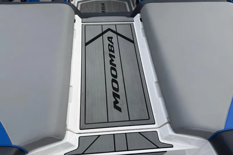 Slide: The Image of 2021 Moomba Kaiyen boat interior with branded flooring and sleek design. - 10