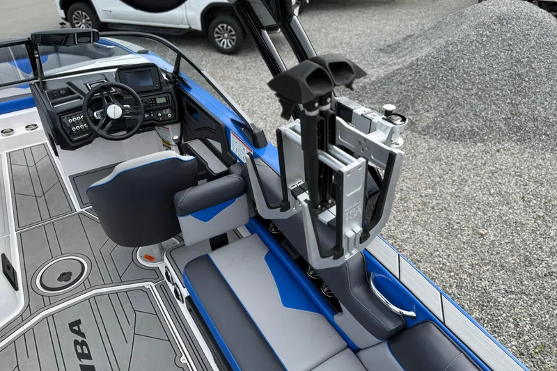 Slide: The Image of 2021 Moomba Kaiyen boat interior with steering wheel, seating, and control panel. - 13