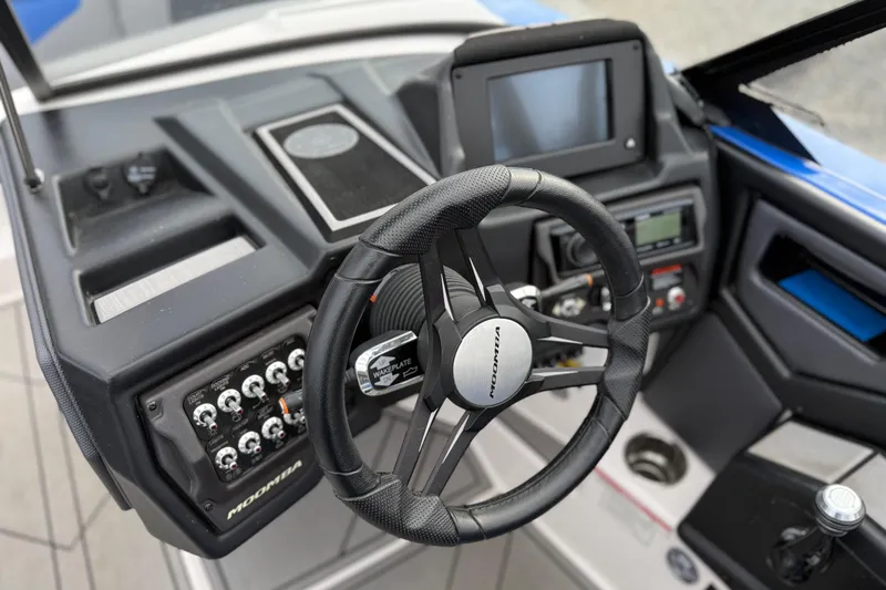 Slide: The Image of 2021 Moomba Kaiyen boat dashboard with steering wheel and control panel. - 15