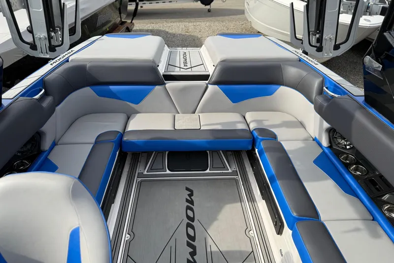 Slide: The Image of Interior of 2021 Moomba Kaiyen boat with blue and gray seating. - 4