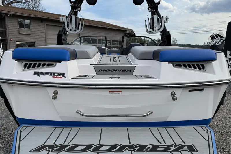 Slide: The Image of 2021 Moomba Kaiyen boat with Raptor Indmar engine, rear view, blue and white design. - 8