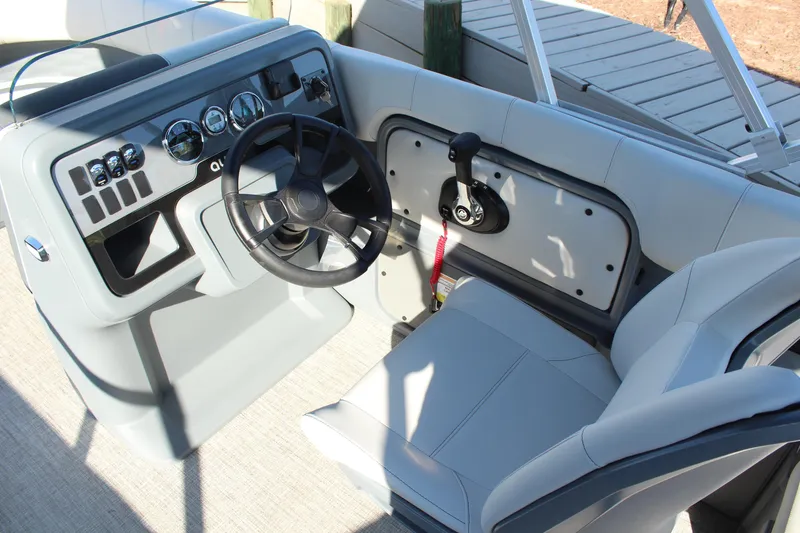 Slide: The Image of 2026 Tahoe Pontoon Aura interior with spacious seating and modern helm design. - 19