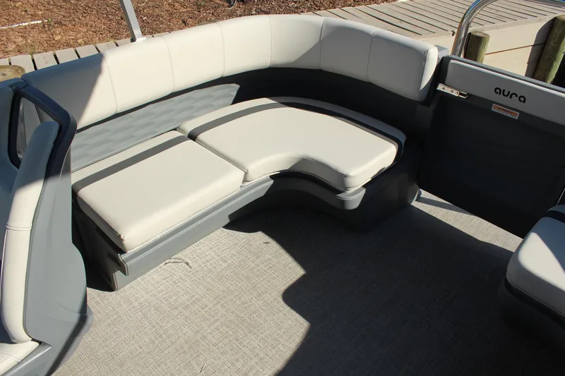 Slide: The Image of 2026 Tahoe Pontoon Aura boat interior with sleek, modern seating and stylish design. - 4