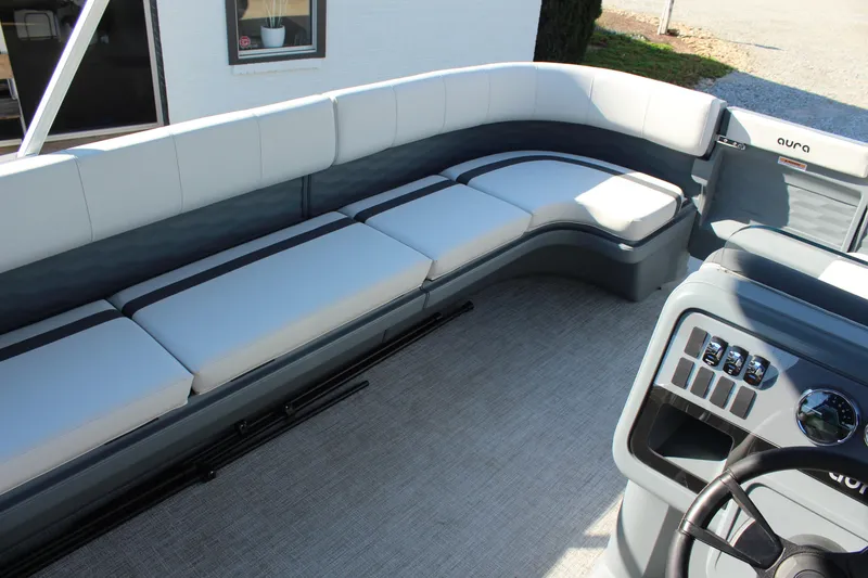 Slide: The Image of 2026 Tahoe Pontoon Aura interior with sleek seating and modern dashboard design. - 6
