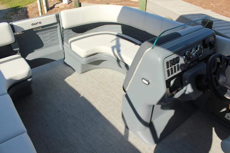 Slide: The Image of 2026 Tahoe Pontoon Aura interior with modern seating and sleek dashboard design. - 7