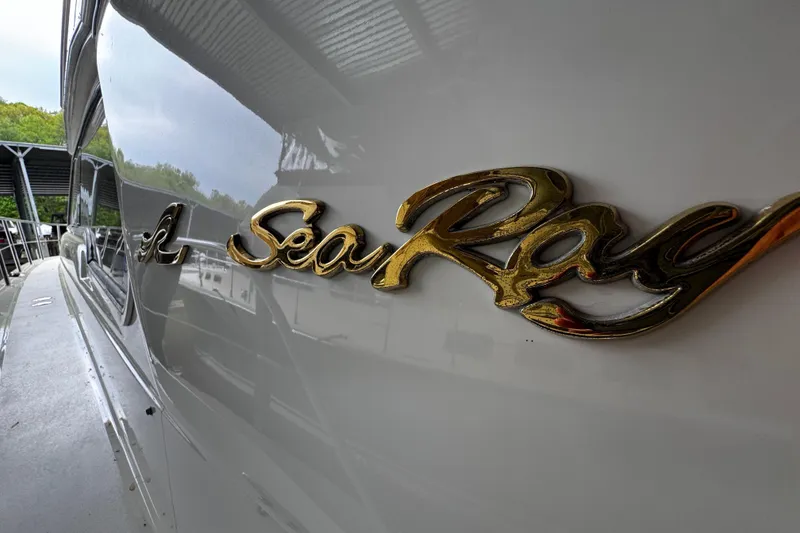 Slide: The Image of Close-up of 1999 Sea Ray 480 Sedan Bridge yacht logo. - 10
